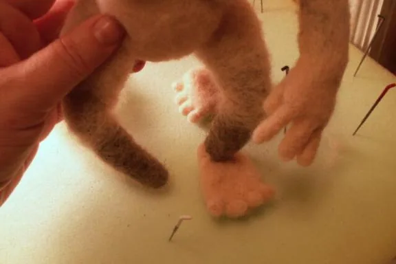 Early needle felting on upholstery foam with painted needles