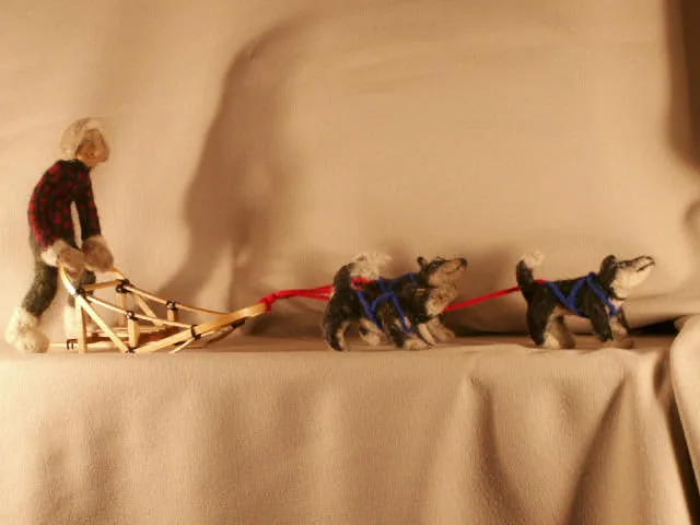 Needle-felted Alaskan dog team and musher by Kay Petal