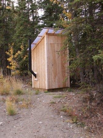 outhouse in Kenny Lake, Alaska outside of the library