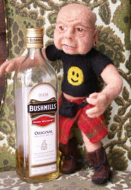 When getting my doll dressed, I let him pick out his own outfit. He insisted on the happy face t-shirt to wear with his favorite plaid kilt. Developing a needle felted character has many surprises.