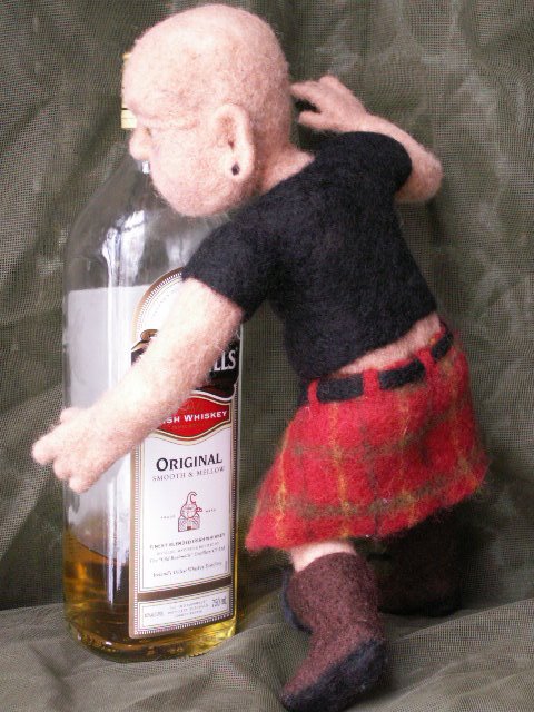 Developing a needle felted character doll is a fun challenge when you let him pick out his own clothing.
