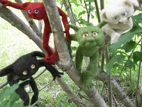 needle felted droits playing in the trees