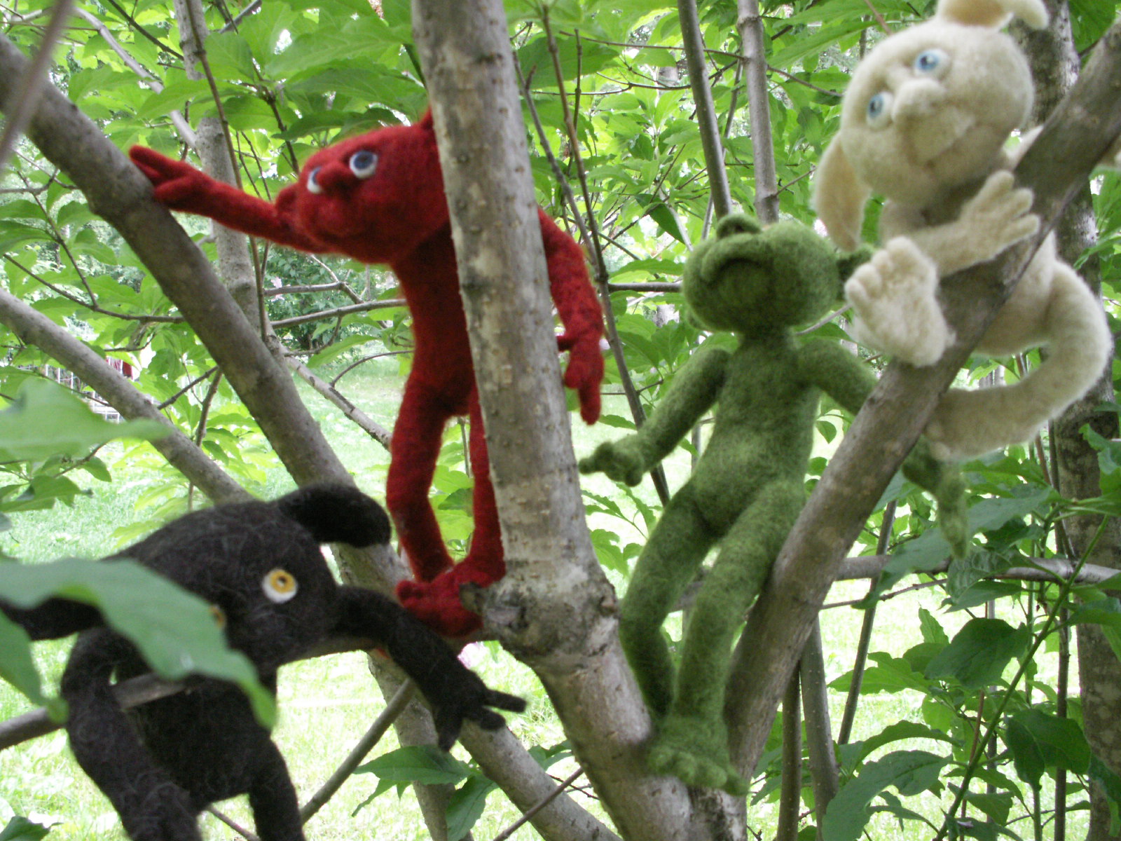 Needle felted characters in the trees